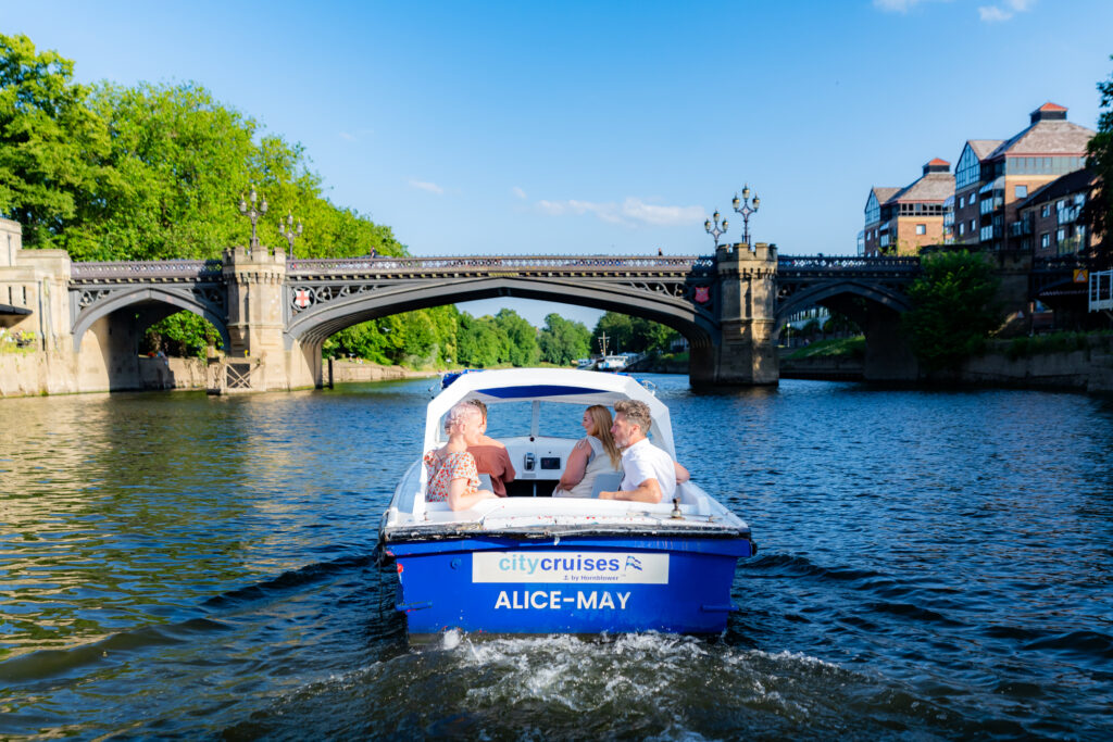 Logo,  Arch,  Boat,  Boating,  Canal,  Outdoors,  Person,  Vehicle,  Water