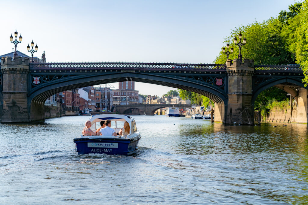 Logo,  Arch,  Boat,  Boating,  Canal,  Outdoors,  Person,  Vehicle,  Water